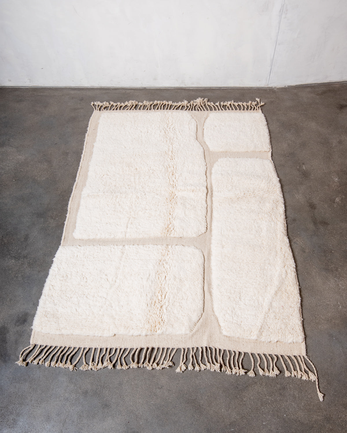 Modern, designer, handcrafted Berber rug from Morocco. Beniourain carpet with minimalist design, natural wool pile and a fluffy texture.